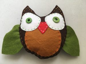 Hand sewing owl