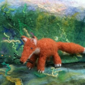 Needle felted fox in woodland scene